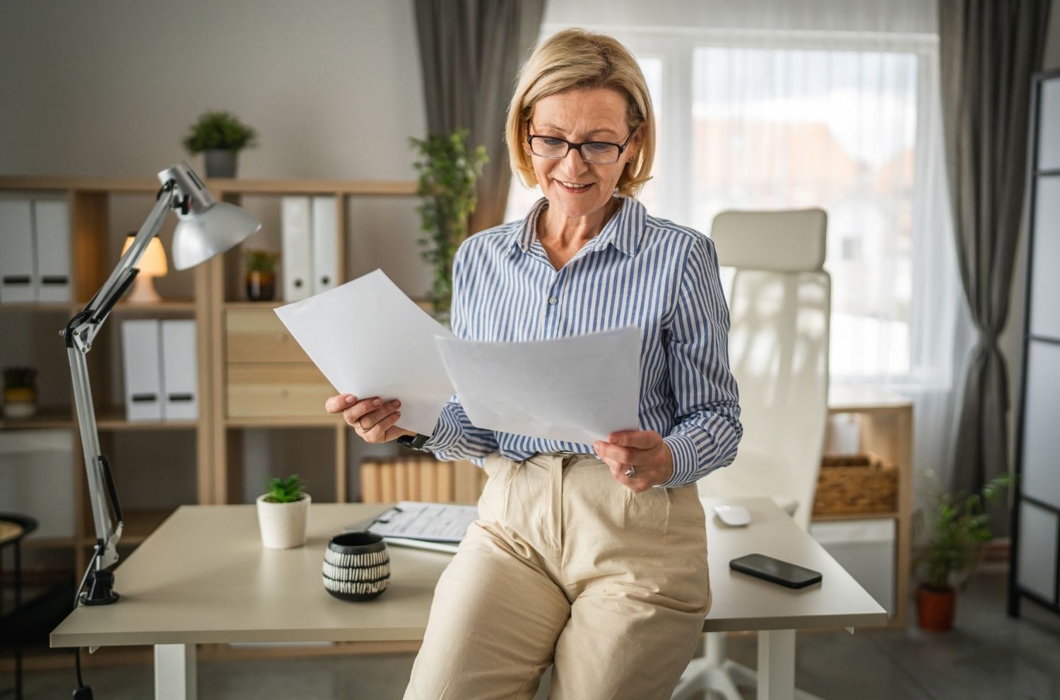 Female real estate agent reviewing paperwork