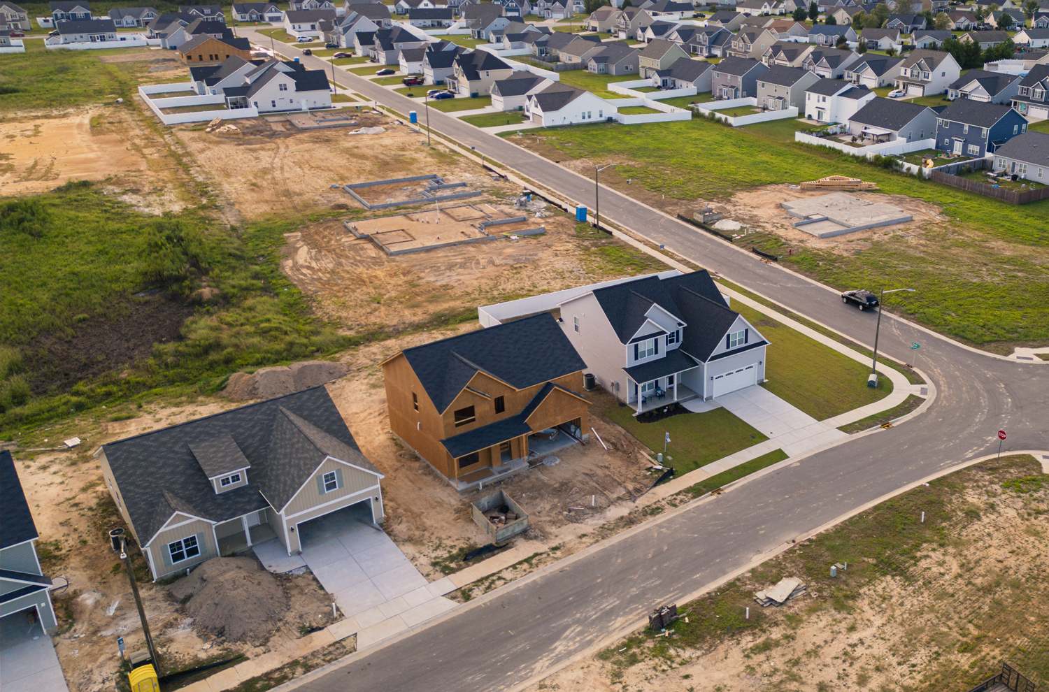 Aerial view of subdivision with new construction homes