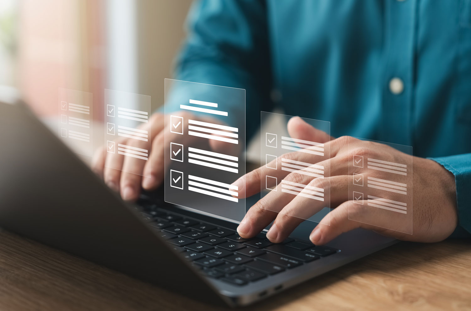 Hands against laptop with digital paperwork