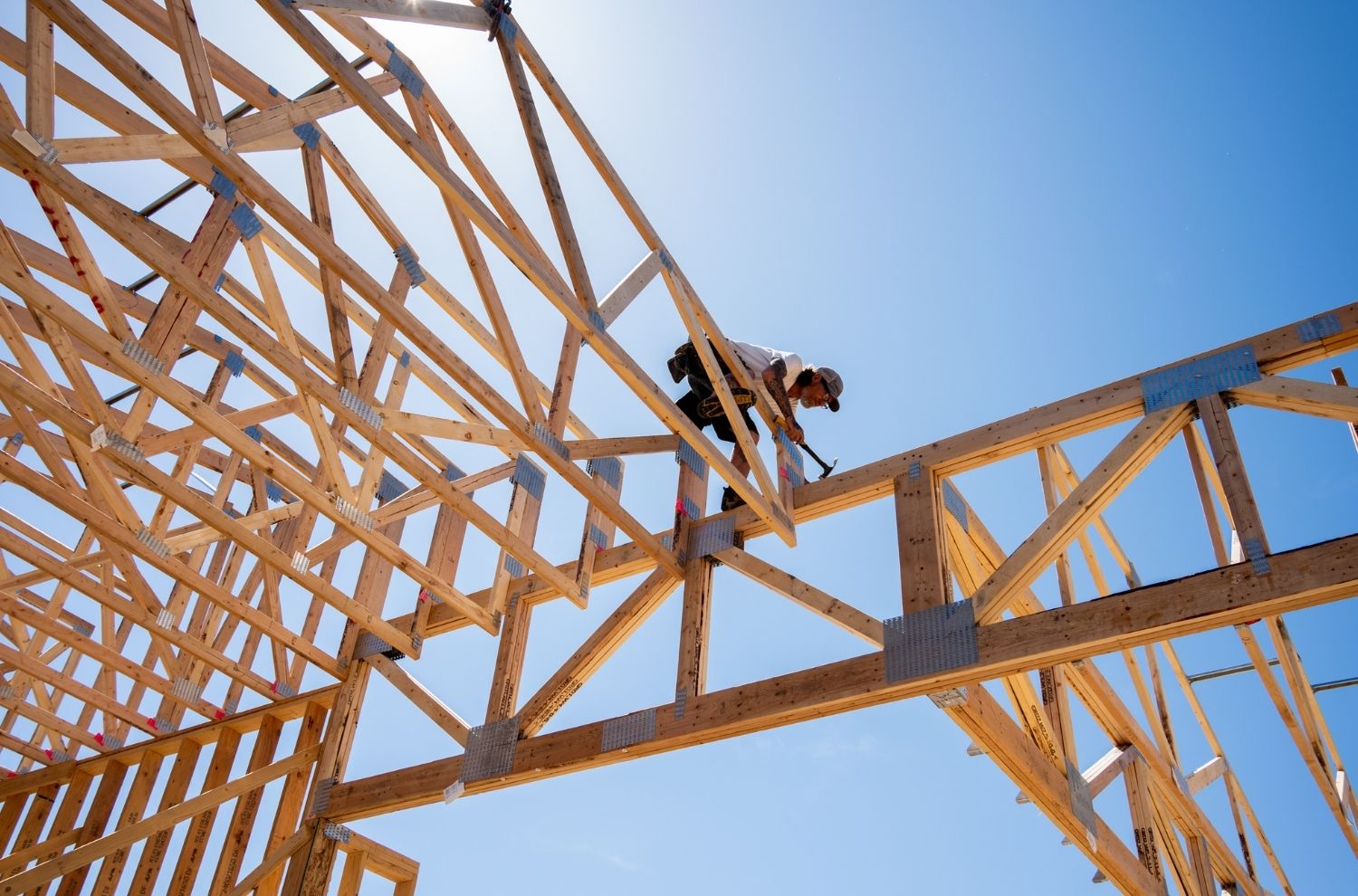 Contractor working on roof during new home construction