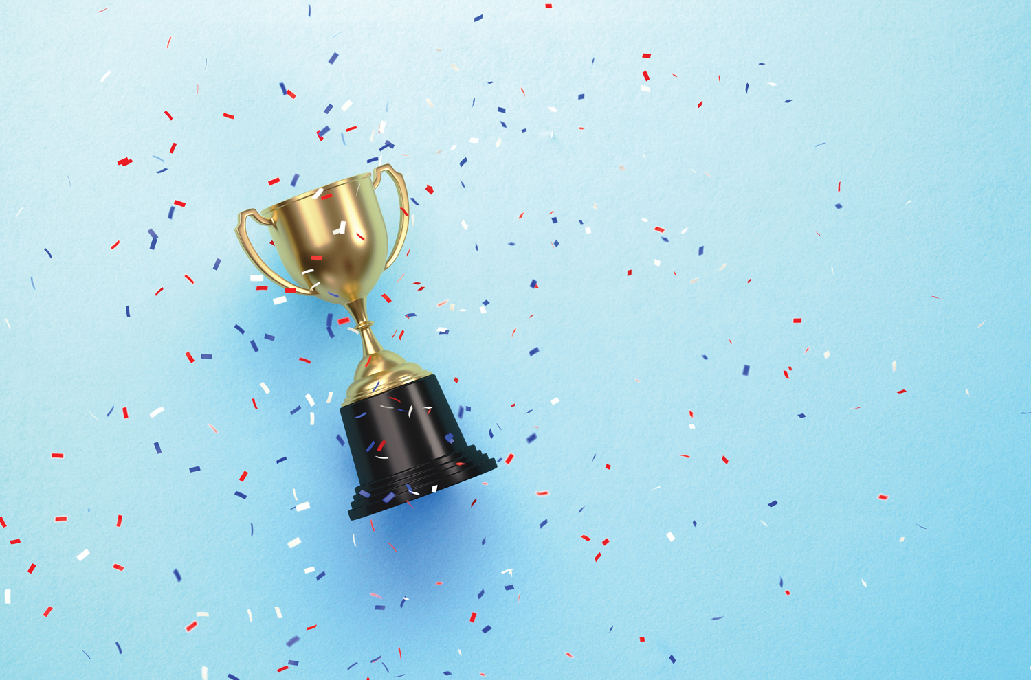 Gold award trophy and multi-colored confetti