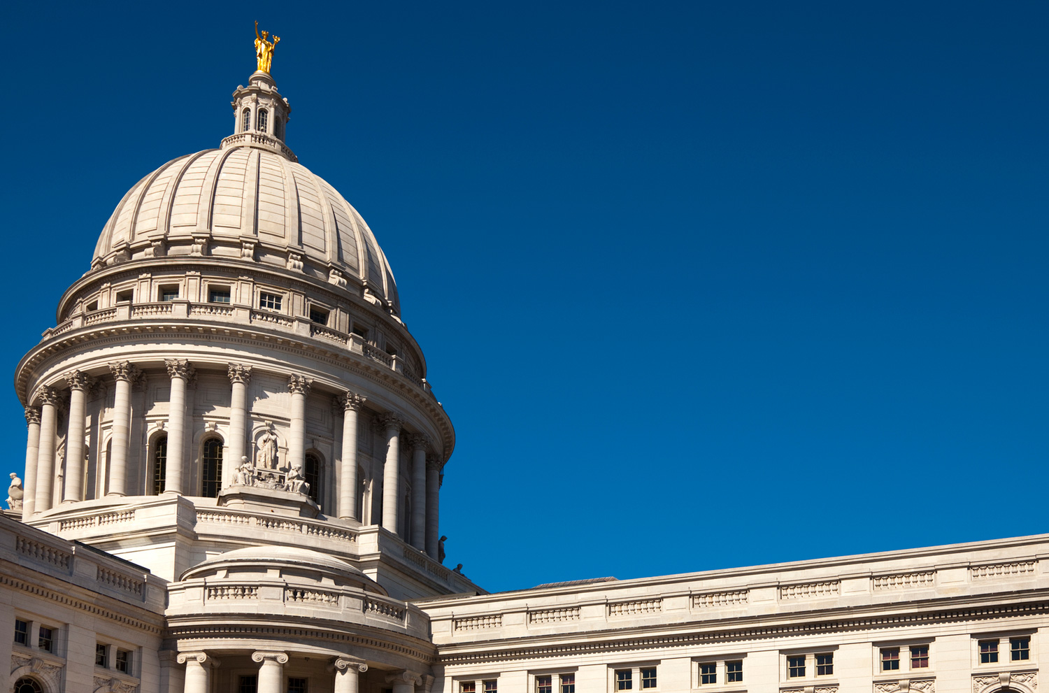 Exterior of dome on Wisconsin Capitol building on sunny day